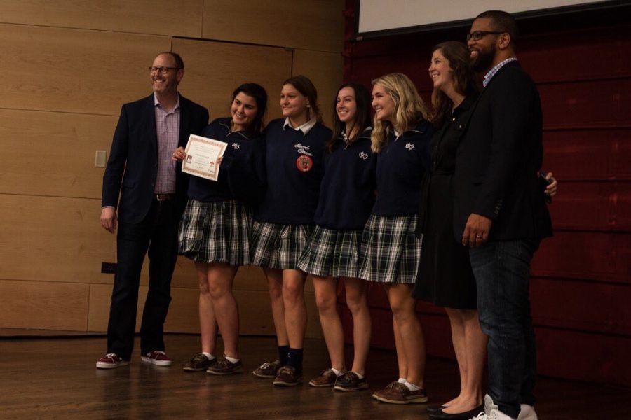 Academy+of+Sacred+Heart+accepts+their+award+for+first+place+in+Cover+Design+for+their+2017-18+Yearbook.